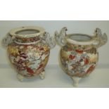 Two Satsuma style vases with moulded lion handles on three moulded lion feet