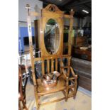 Edwardian oak hall stand with central bevelled edged mirror panel with bench seat and stick stand