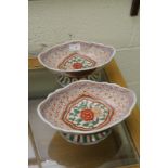 Pair of Oriental ceramic bowls on raised pedestals one with six digit signature panel