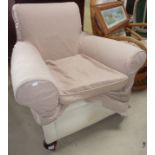 Upholstered armchair on bun feet