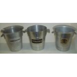 Three steel champagne buckets