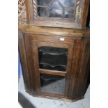 19th C oak corner cupboard enclosed by a single glazed cupboard door