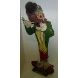 Vintage felt work clown playing a fiddle