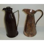 Art Nouveau copper jug with embossed stylized decoration and stamped to base J.