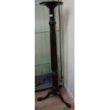 Mahogany torche stand on fluted column on three out splayed supports