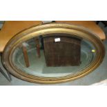 Gilt framed oval bevelled edge wall mirror