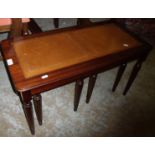 Nest of three occasional tables with leather insert tops