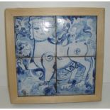 Set of four blue and white tiles in wooden frame