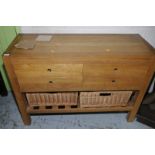 Modern light oak side cabinet with three drawers above gallied under tier with two wicker basket