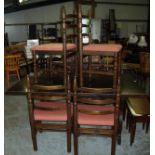 Oak extending dining table and set of six chairs