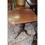 19th C mahogany tilt top tripod table with rectangular top on turned column