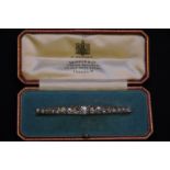 Cased multi stone diamond bar brooch, th