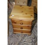 Pine three drawer bedside chest