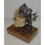 Unusual hermit crab figure with metal work body emerging from the shell on marble base