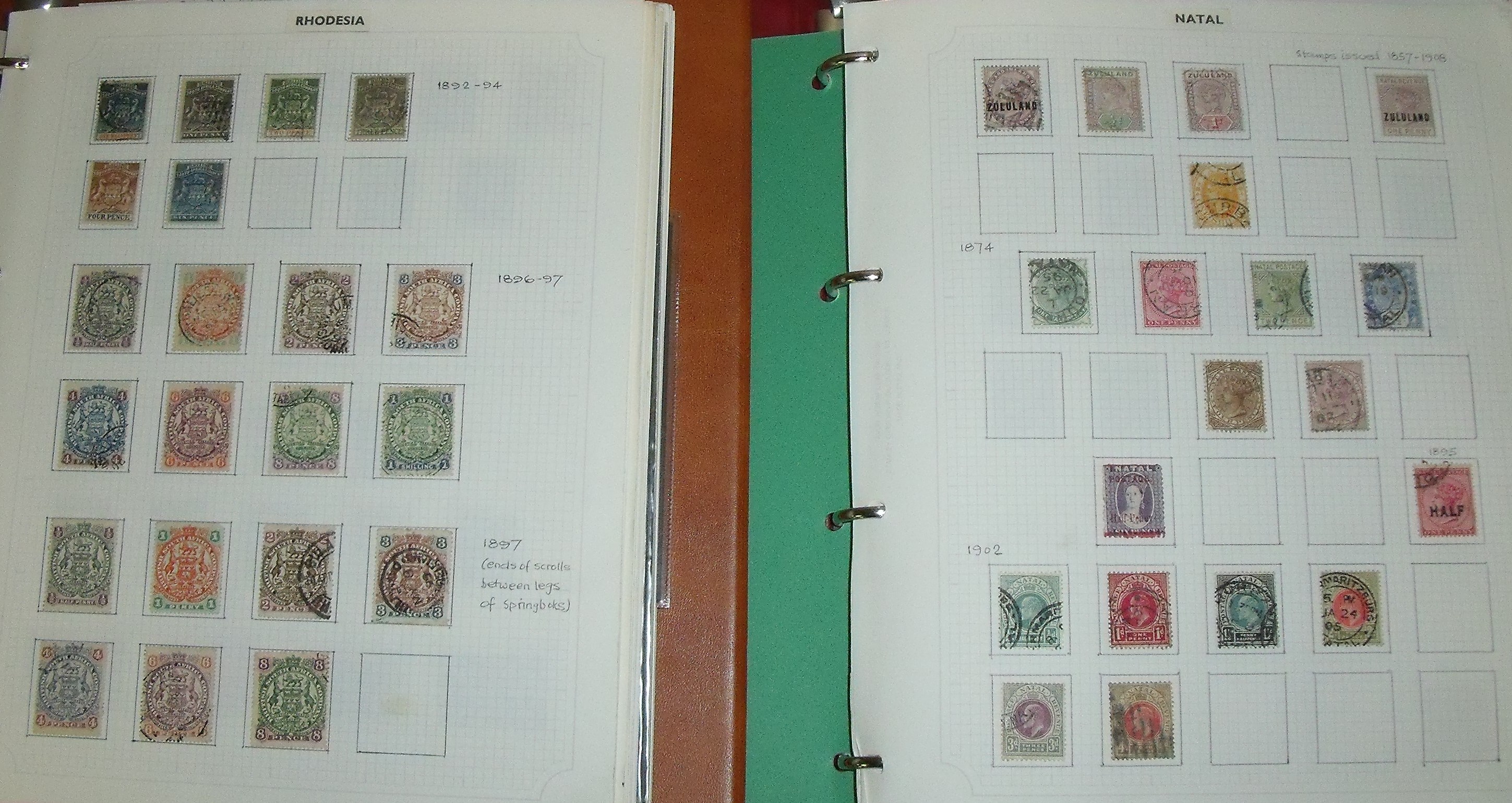 Two large ring binder stamp albums containing Rhodesia, Nyasaland, Zimbabwe, Zambia, Botswana,