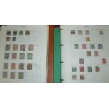 Two large ring binder stamp albums containing Rhodesia, Nyasaland, Zimbabwe, Zambia, Botswana,