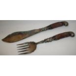 Pair of large horn handled servers with scrolled silver plated mounts and engraved blades