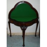 Mahogany demi-lune fold over card table on four carved supports