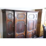 Victorian mahogany break front cupboard with two central panelled cupboard doors revealing shelved