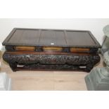 Unusual oriental carved hardwood rectangular stand with elaborately carved detail and gilt work