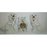 Pair of Staffordshire style spaniels and Staffordshire style clock case with figures and gilt