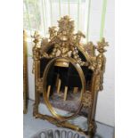 Extremely elaborate and ornate Victorian style gilt framed wall mirror (85cm x 138cm)