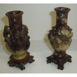 Pair of Chinese carved soapstone spill vases with applied dragon and carved bases