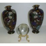 Pair of ovoid cloisionne vases with circular and floral patterns and small glass witches ball on