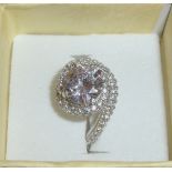 Silver ring set with large cz circular stone and cz chip swirl stamped 925 (size N)