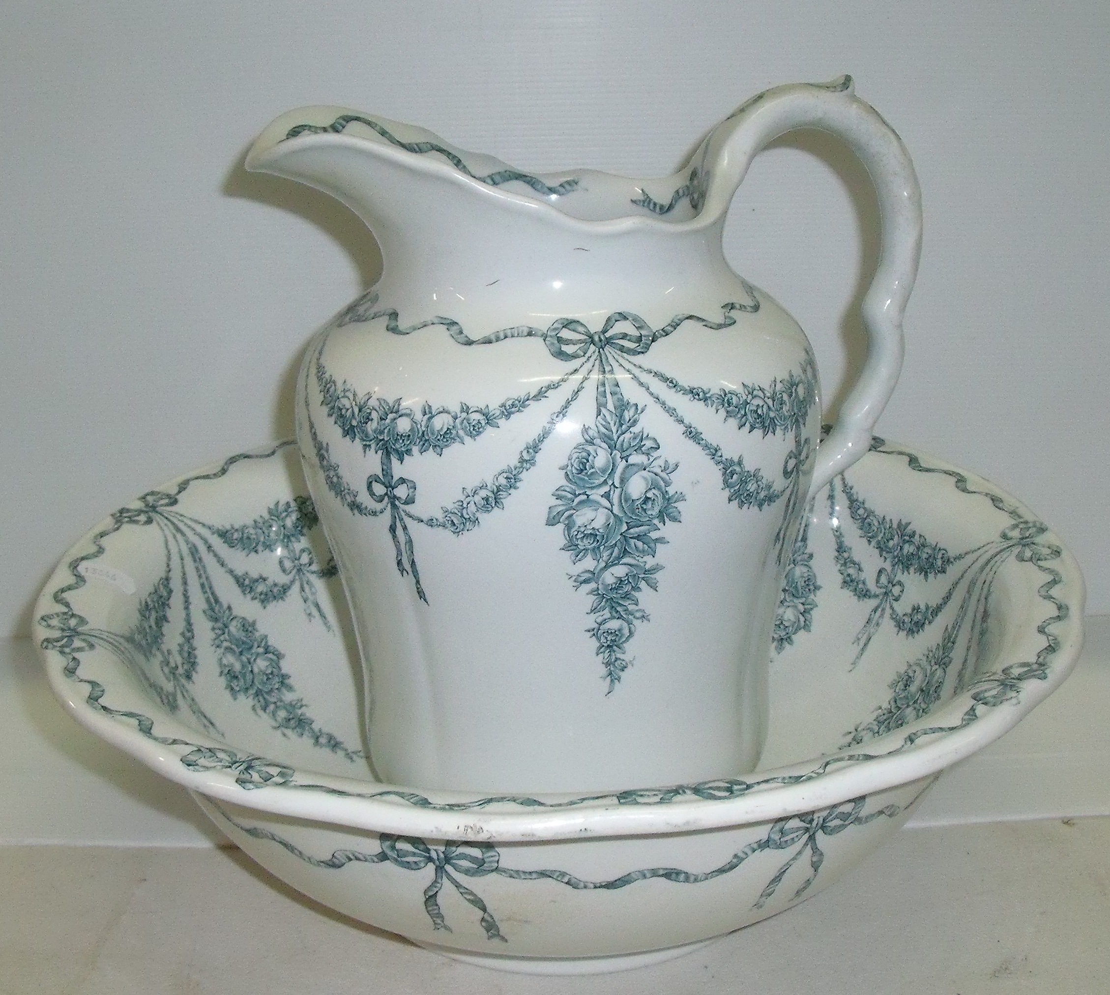 Cauldon green and white water jug and bowl decorated with swags with painted back stamp and