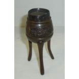 Chinese bronze pot on three splayed legs and applied floral detail