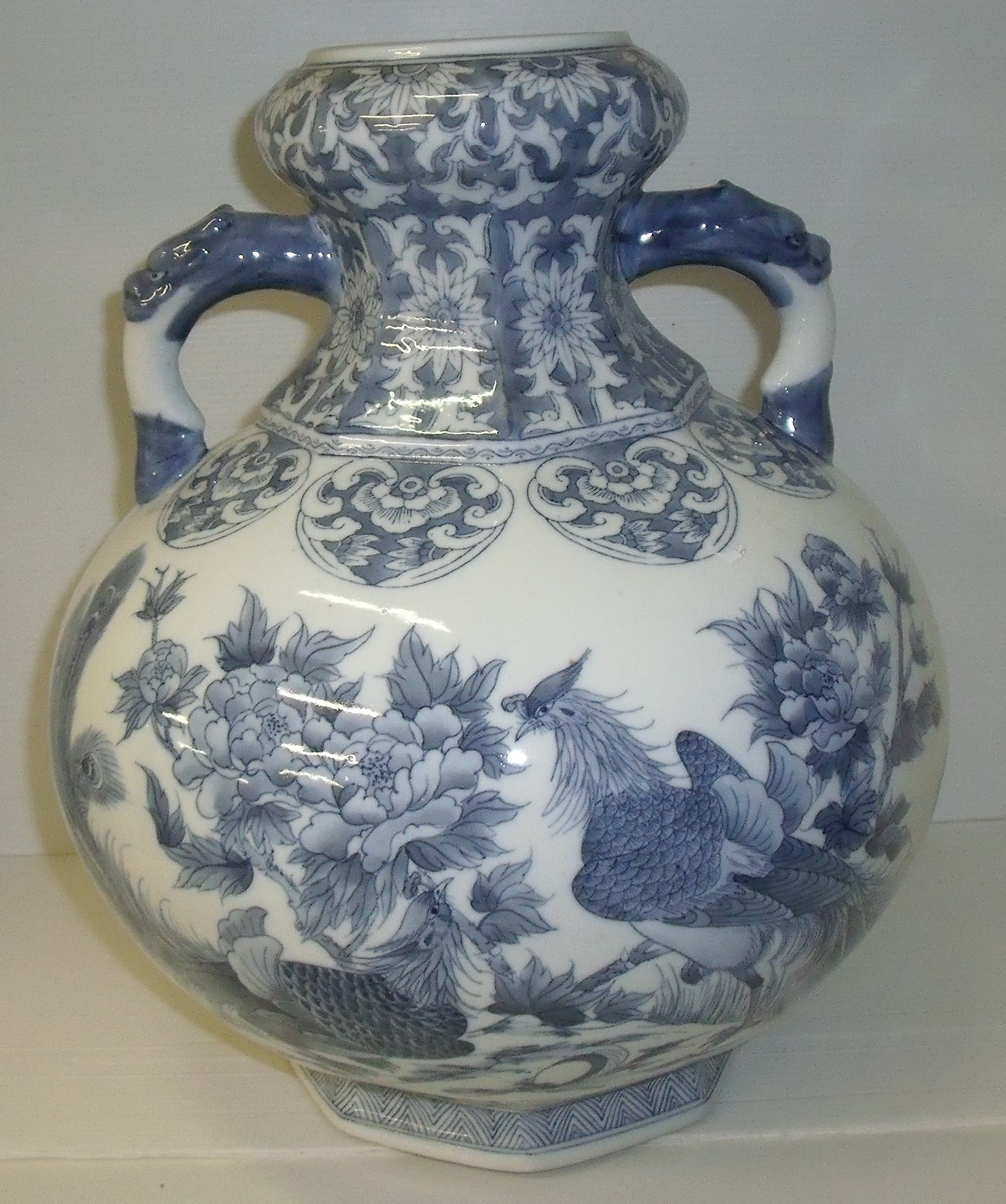 Large blue and white twin handled bottle