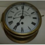 Brass cased wall mounted clock by Prescot Clock Co.