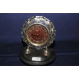 Majeck Russian made mantel clock with cut glass case on chrome supports and bakelite base the back