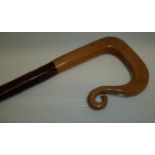 Walking stick with carved and turned wooden handle