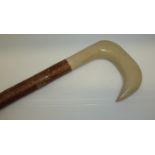 Walking stick with carved and turned painted handle