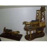 Two brass models of horses and mining tower mounted on wooden plinth