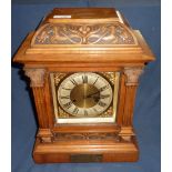 Carved walnut cased mantel clock, brass