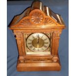 Walnut case mantel clock with brass dial