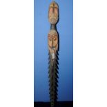 Possible Solomon Islands carved wood staff with large wooden barbs and two carved face figures with