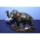 Early 20th C Japanese bronze figure of an elephant with three digit signature panel to the