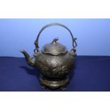 Chinese bronze teapot with swing handle, the body decorated with scenes of mounted horseman,