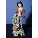 19th C Dresden porcelain figurine of a grape seller with blue printed mark to base (7cm high)
