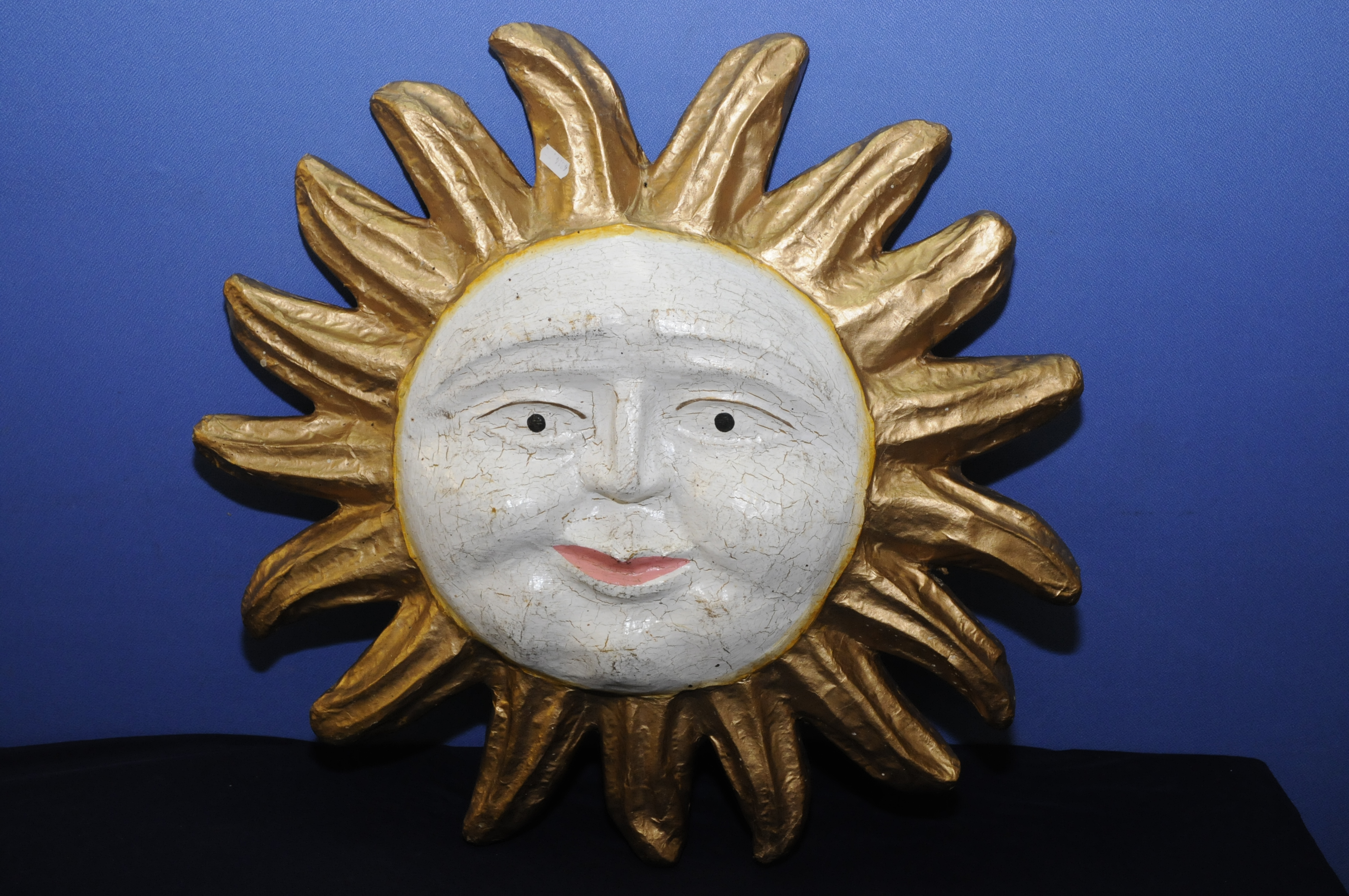 Unusual mid 20th C French papier mache smiling sun face (58cm diameter)