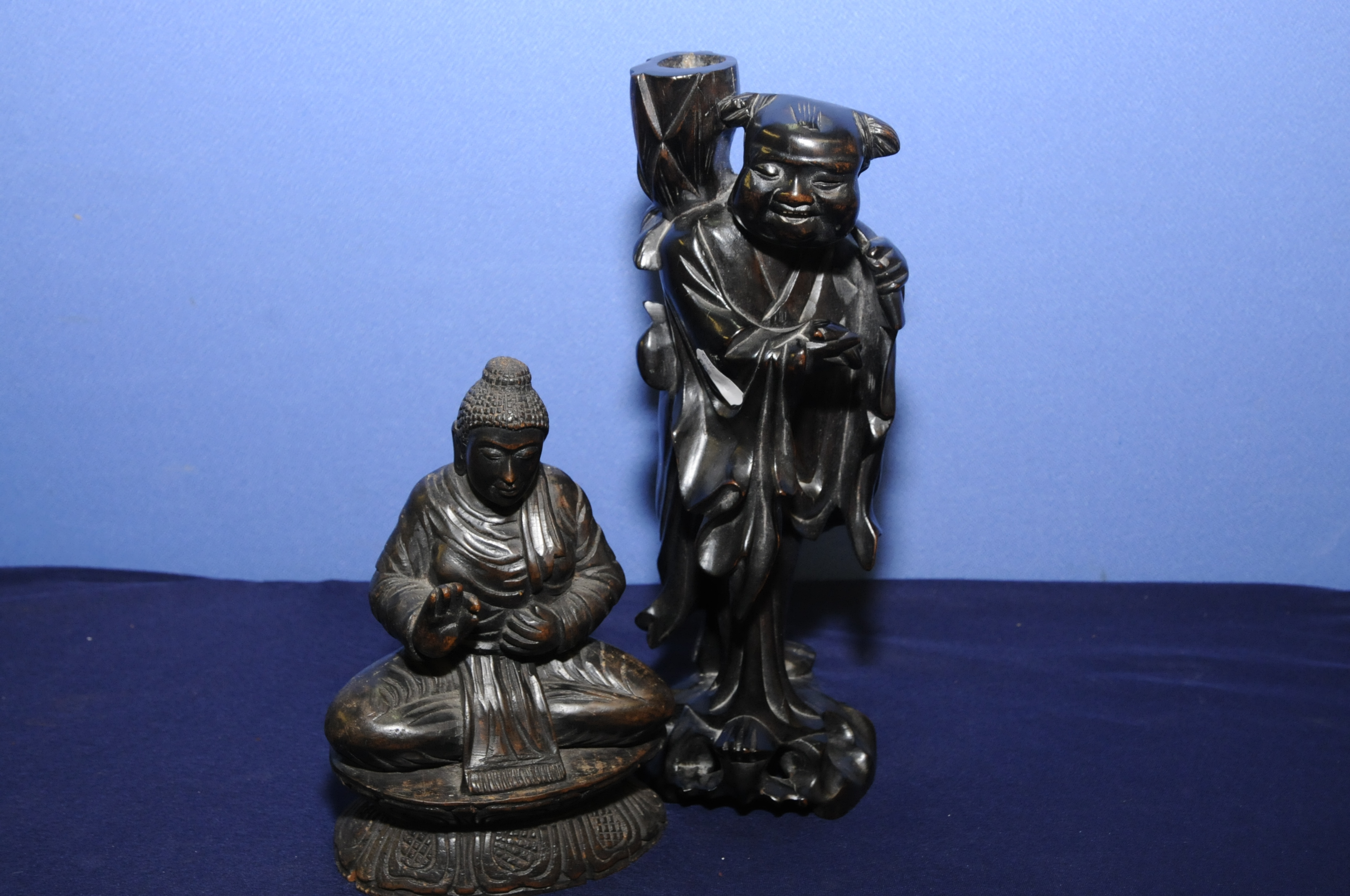 Carved Buddha deity and a root carving of a sage (2)