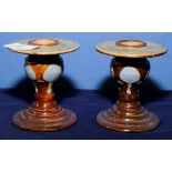 Pair of Royal Doulton Stoneware glazed candlesticks with circular tops and bases,