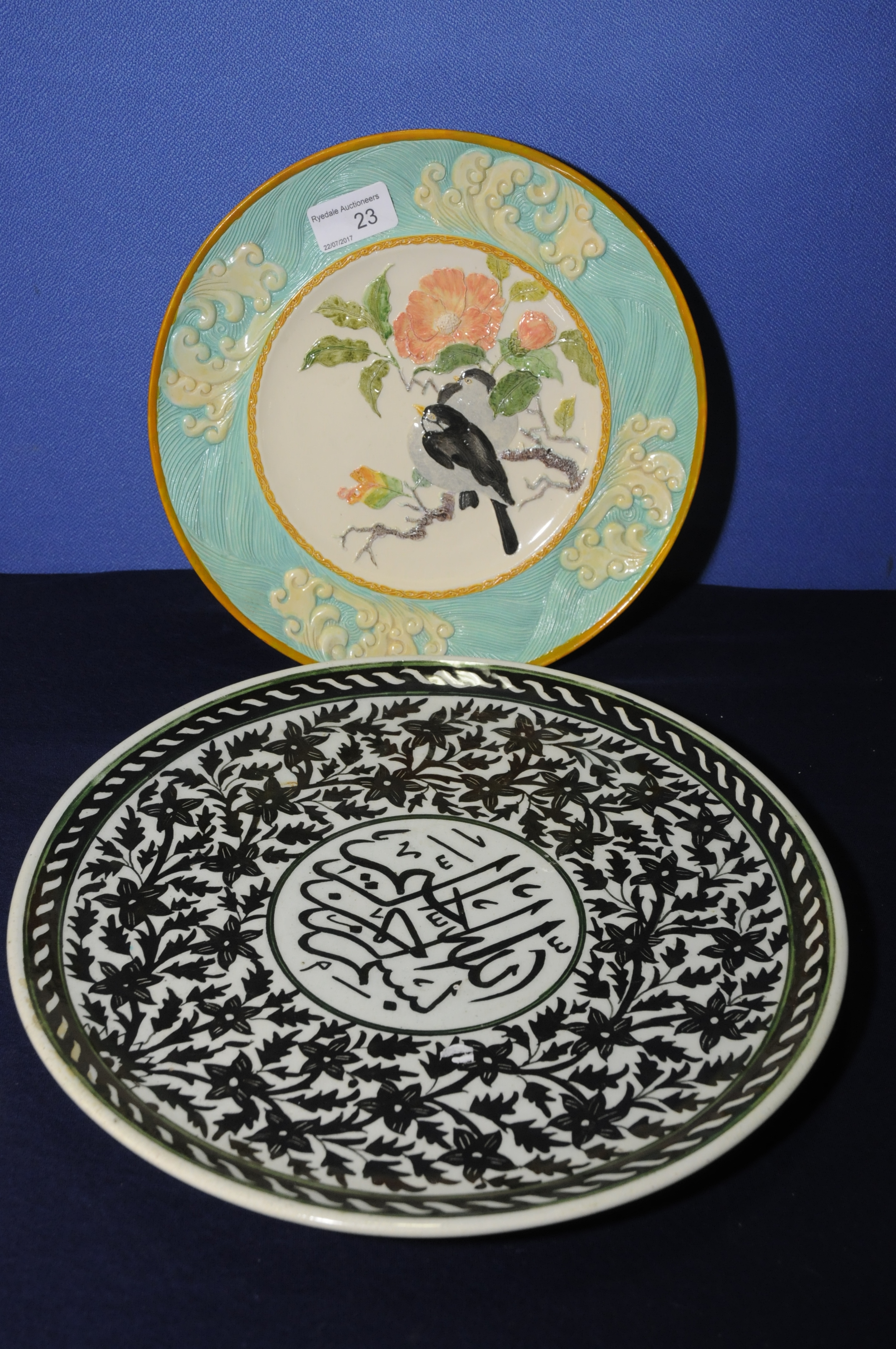 20th C Studio style plate with central panel depicting birds on branches with border of wave type