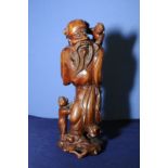 Carved hard wood figure of a sage