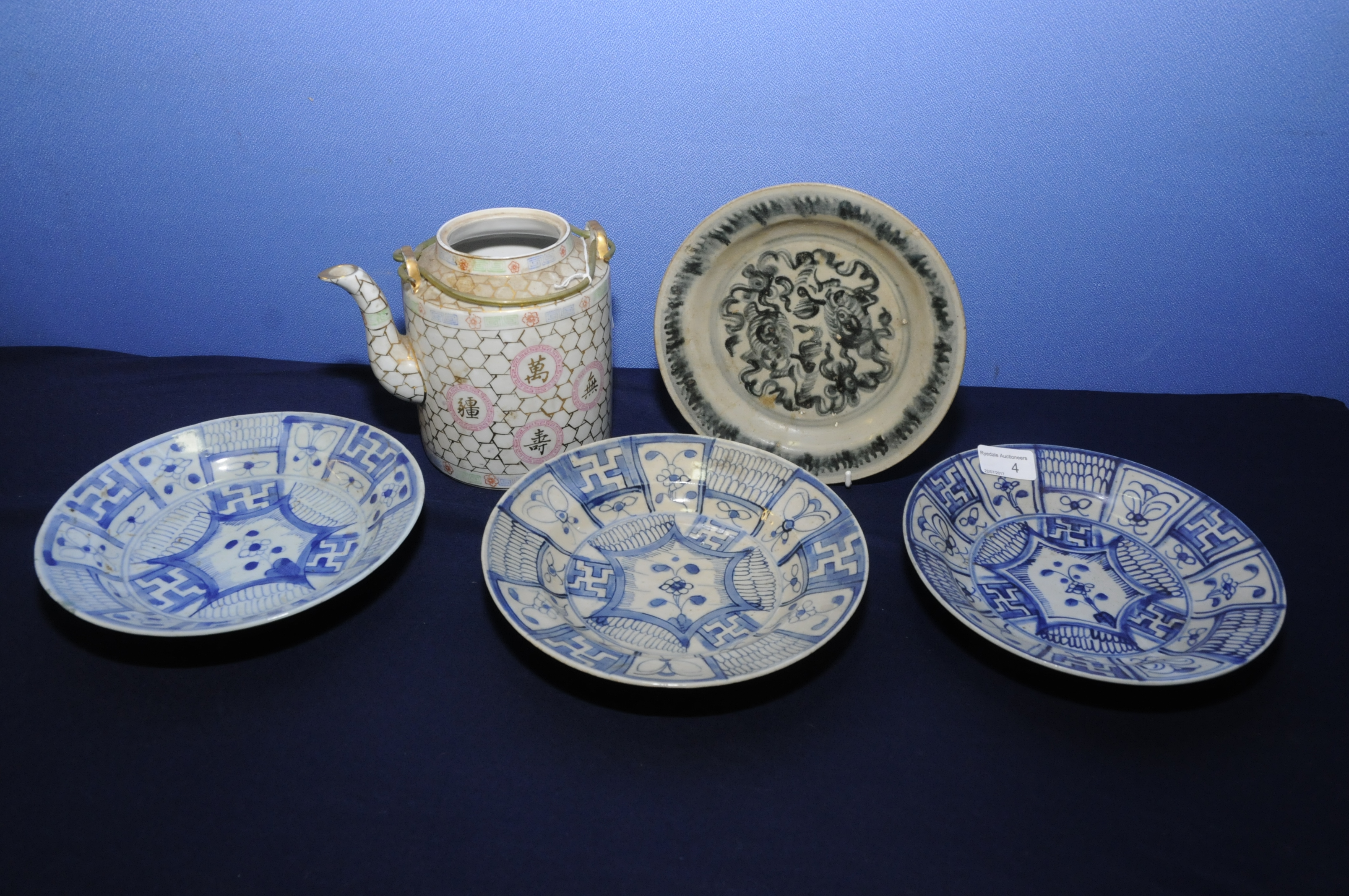 Set of three Chinese blue and white shallow dishes (21cm diameter) each with central floral pattern