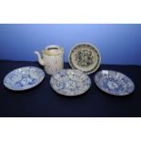 Set of three Chinese blue and white shallow dishes (21cm diameter) each with central floral pattern